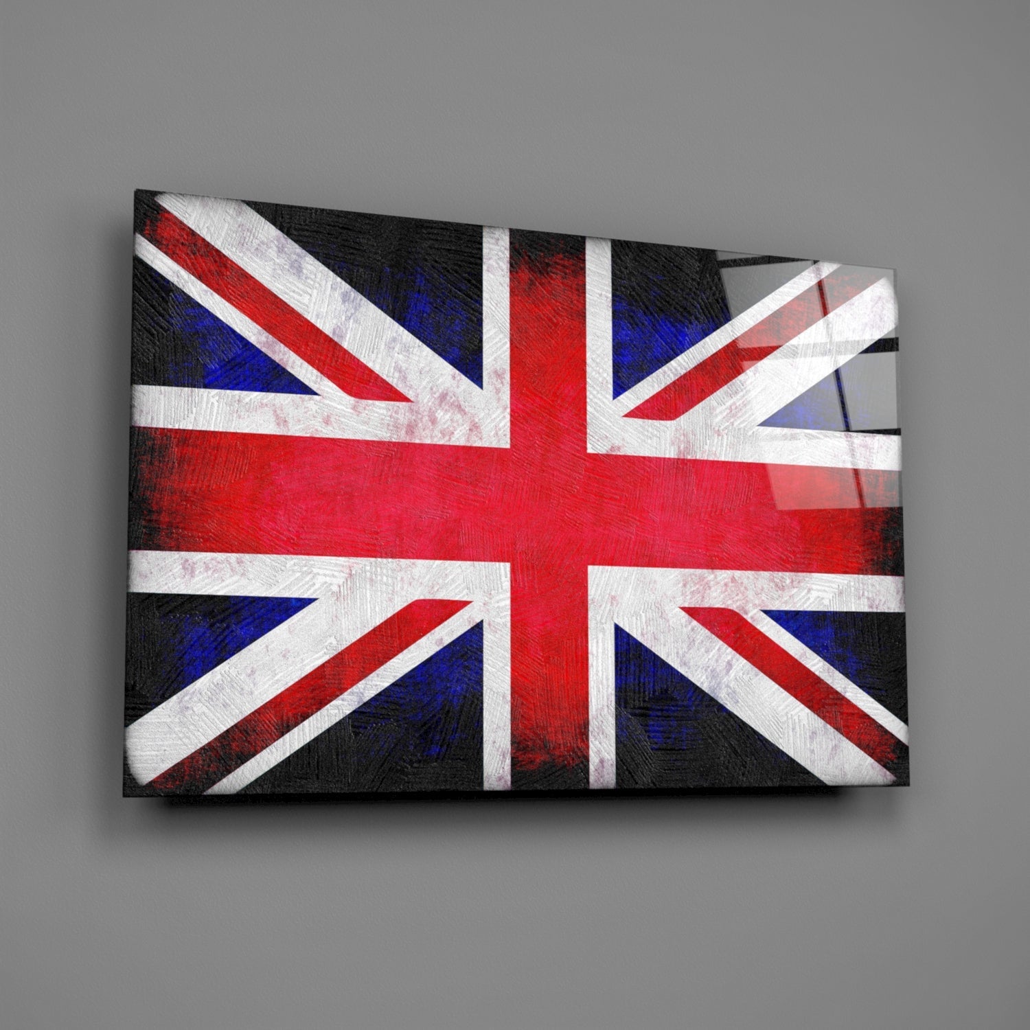 Union Jack flag design on textured glass wall art panel with red, white, and blue colors, displayed at angle against gray background.