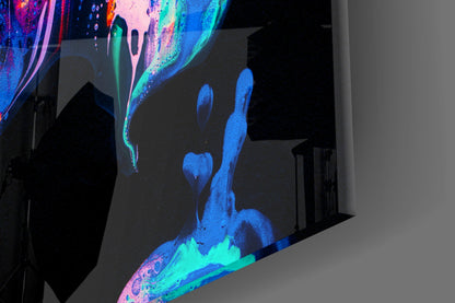 Neon glass wall art with glowing blue, cyan, and pink flame designs illuminated against dark interior wall.