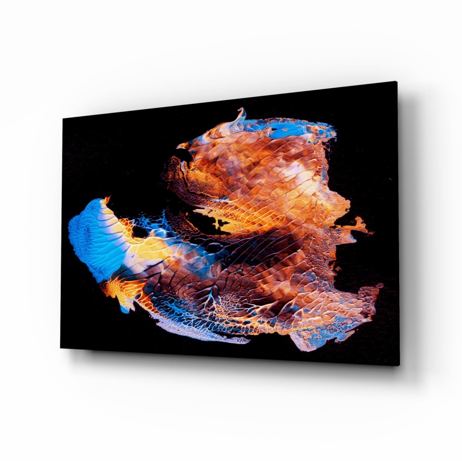 Colorful glass wall art piece featuring abstract layered textured design in blue, orange, yellow, and coral tones against black background, displayed at angle.