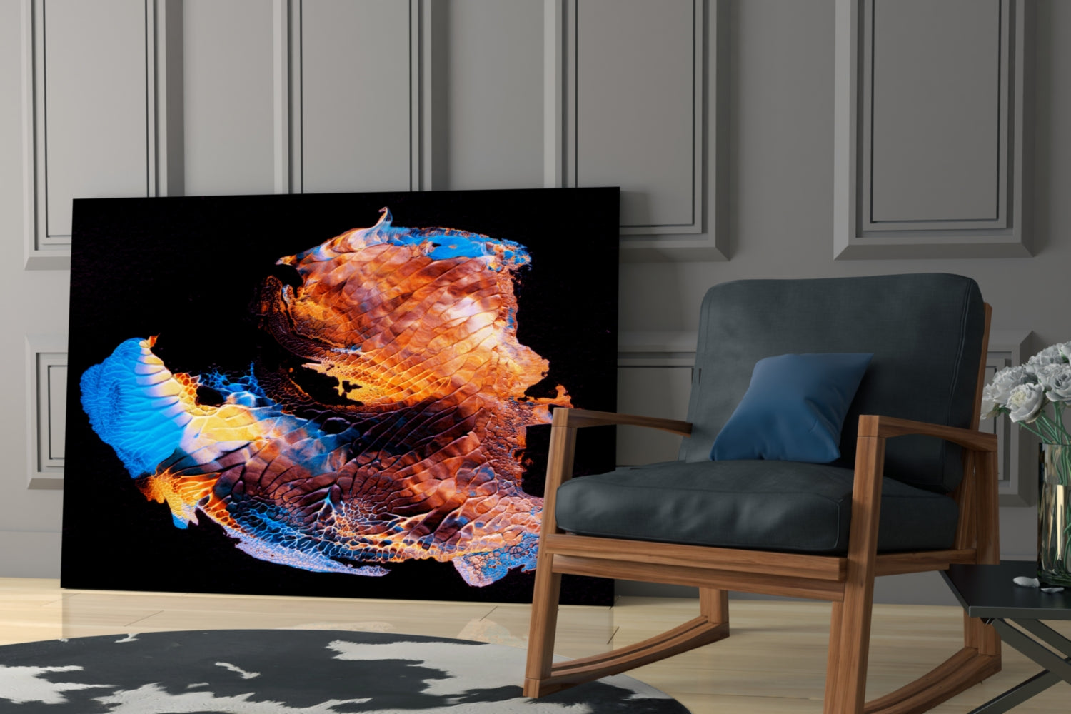 Abstract glass wall art displaying a luminous blue and orange sculptural form against black, displayed in a modern living room setting.