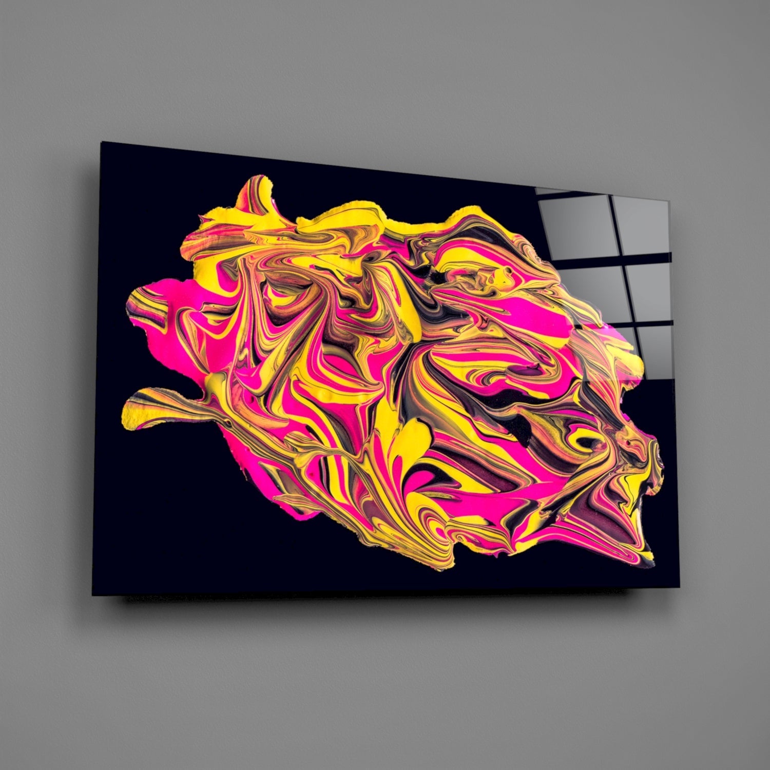 Vibrant glass wall art with swirled yellow, magenta, and brown patterns on black background, mounted at angle.
