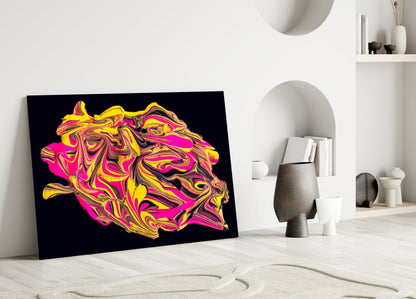 Vibrant abstract glass wall art with swirled yellow, pink, and magenta patterns on black background, leaning against white wall in minimalist interior.