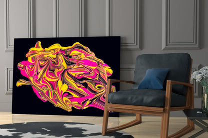 Vibrant yellow, pink, and magenta swirled glass wall art displayed behind a wooden-framed chair in a modern living room interior.