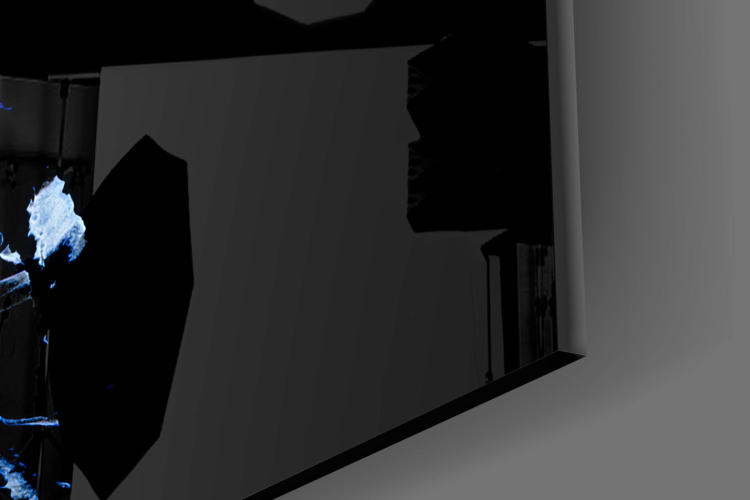 Abstract gray glass wall art installed in corner with blue neon lighting accent visible on left side.