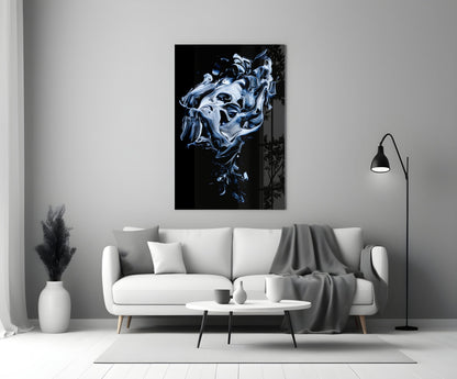 Abstract gray and blue swirling glass art displayed above white sofa in minimalist living room interior.