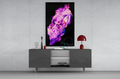 Abstract purple and magenta fluid glass wall art displayed above a gray media console with red accents and decorative objects.