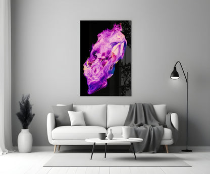 Abstract purple and magenta glass wall art with fluid swirled patterns displayed above a white sofa in a modern living room.