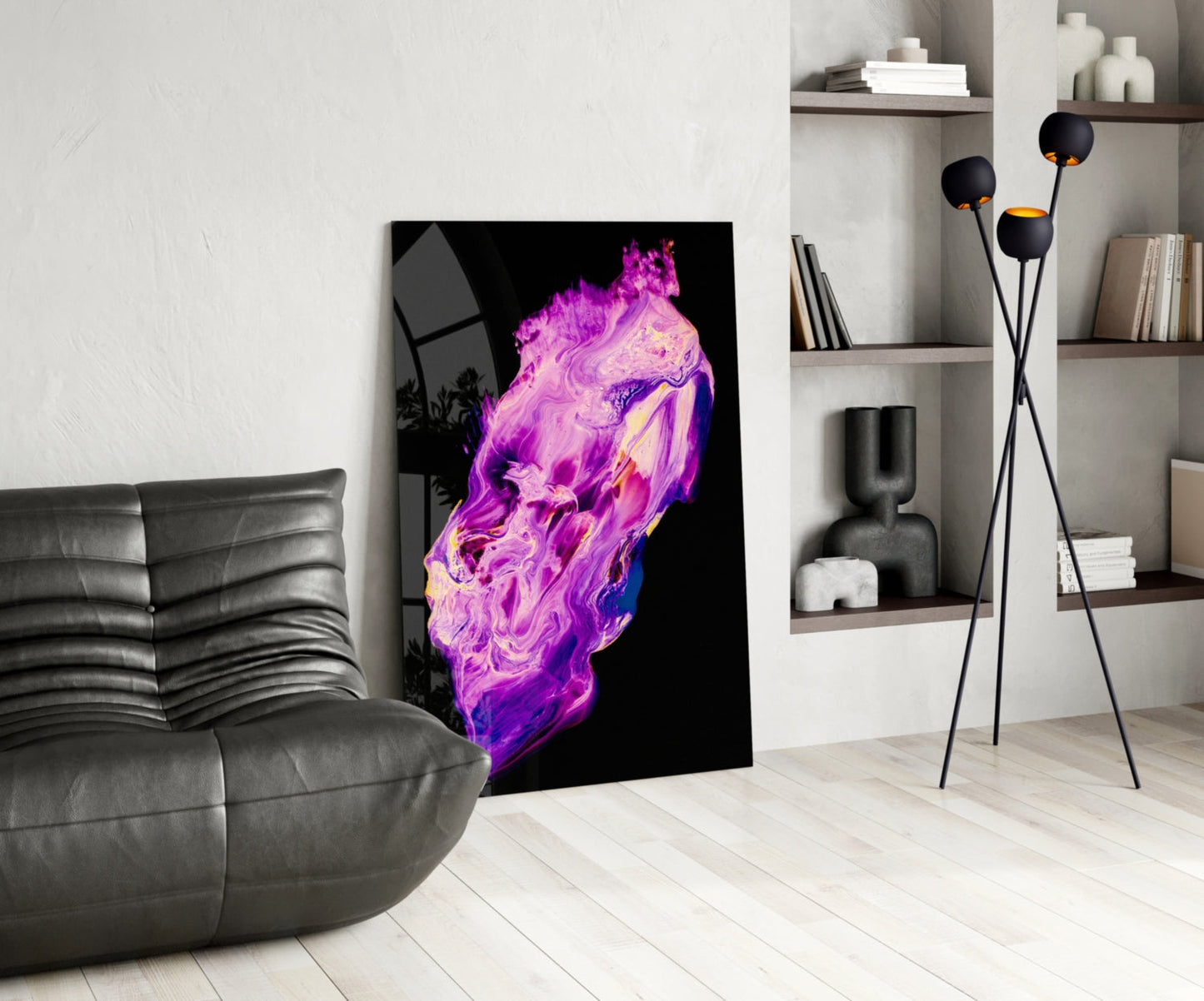 Abstract purple and magenta fluid art glass panel displayed in modern living room next to gray sofa and shelving.