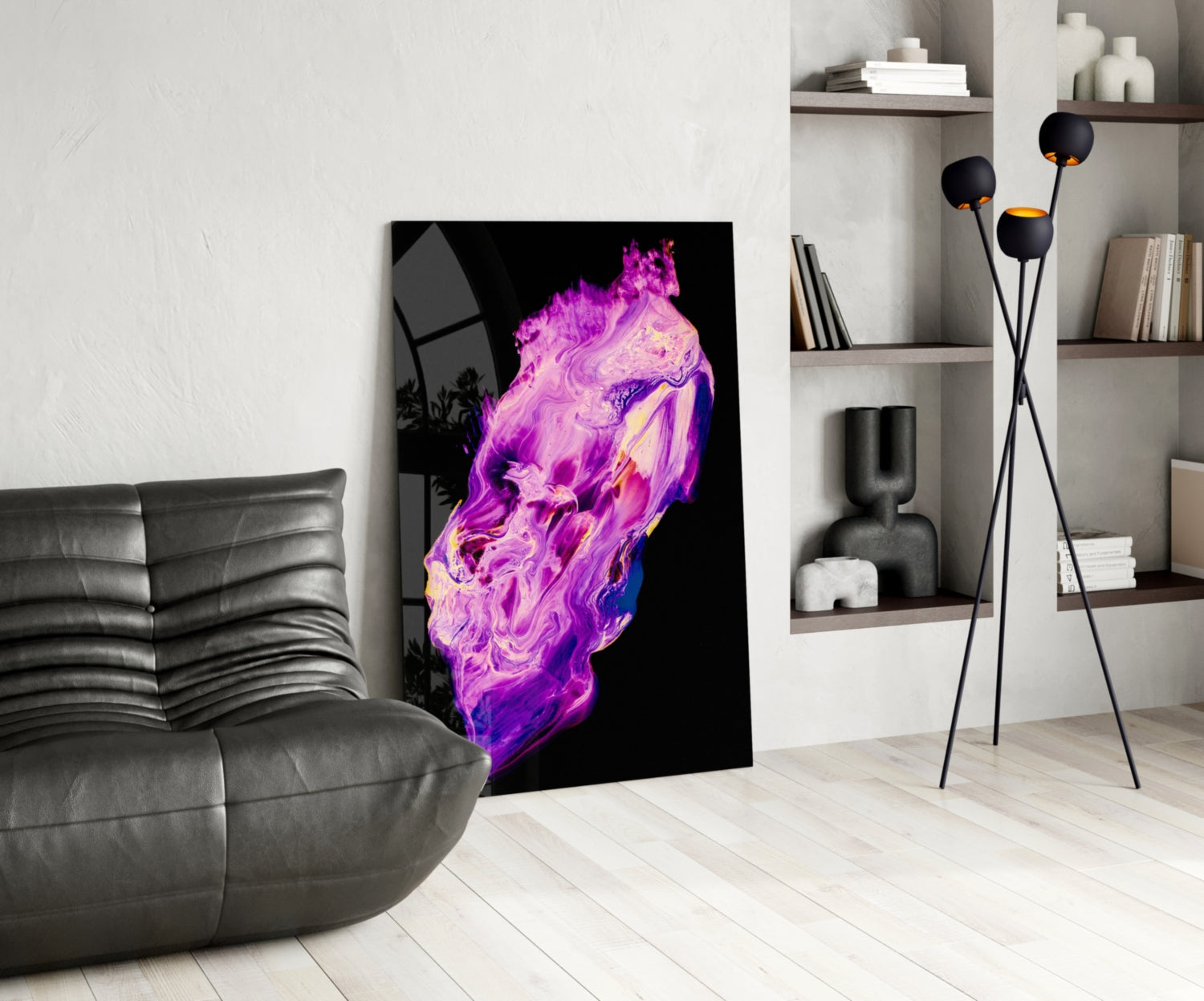 Abstract purple and magenta fluid art glass panel displayed in modern living room next to gray sofa and shelving.