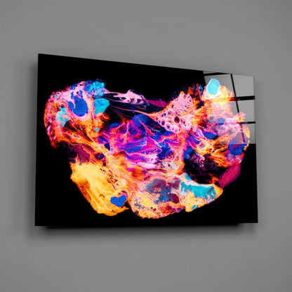 Colorful glass wall art displaying a vibrant, abstract map in neon hues of pink, blue, orange, and yellow against black background.