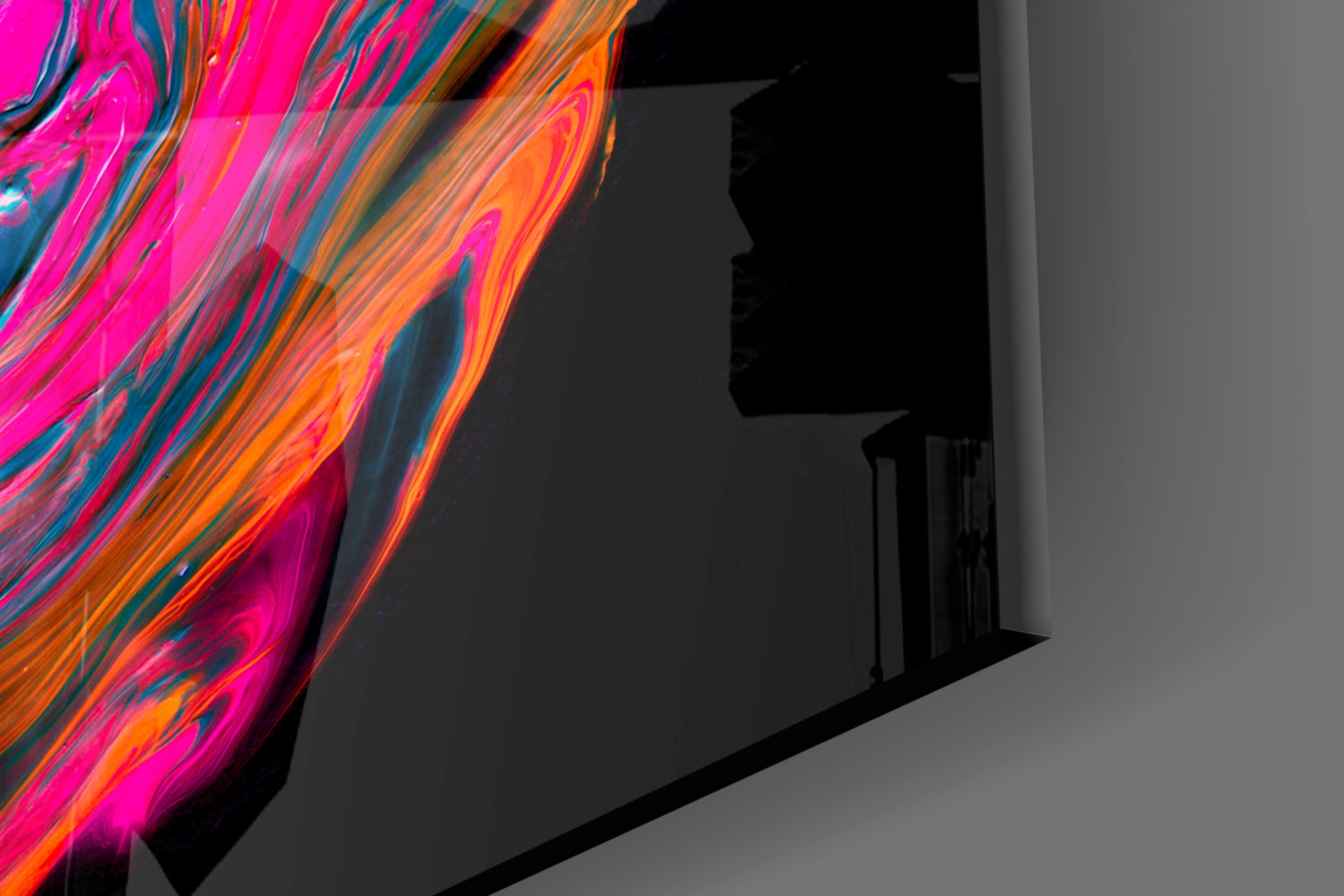Vibrant neon pink and orange glass art panel with flowing striped pattern displayed against gray wall corner.