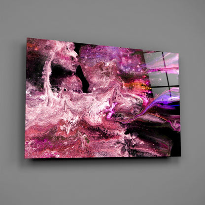 Angled view of purple and pink swirled glass wall art mounted on gray wall, displaying fluid abstract patterns with black accents.