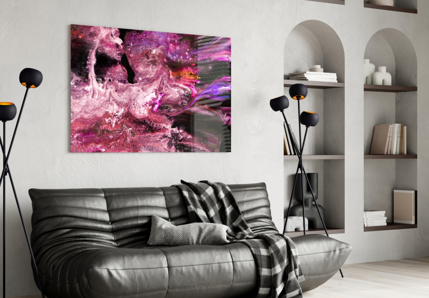 Purple Space Glass Wall Art displayed above black leather sofa in modern living room with white built-in shelving.