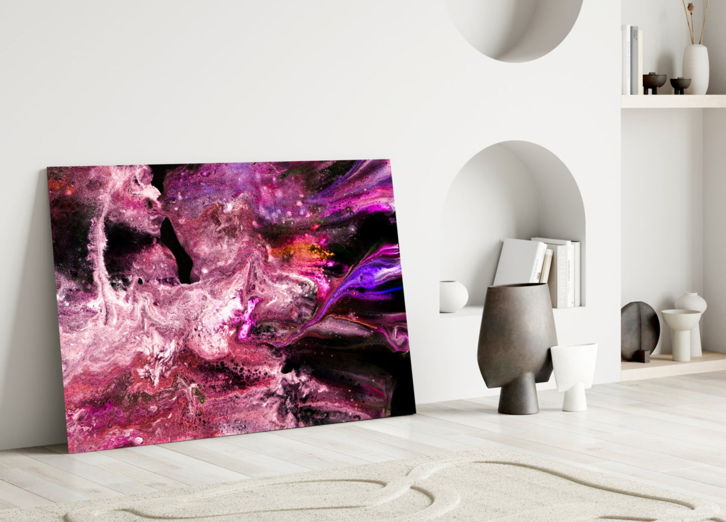 Purple Space Glass Wall Art leaning against white wall in minimalist room with sculptural vessels and shelving.