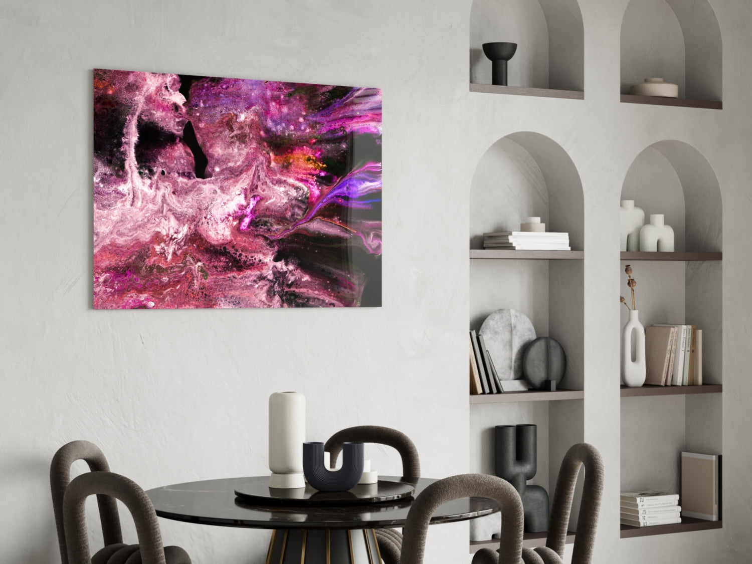 Purple and magenta abstract glass wall art displayed above a black dining table in a modern interior with built-in shelving.