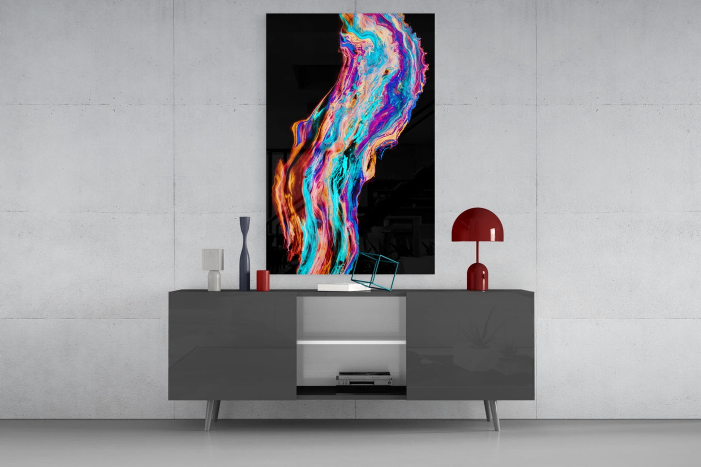 Colorful flowing glass wall art with vibrant neon swirls of blue, pink, orange, and purple displayed above a gray modern console table.