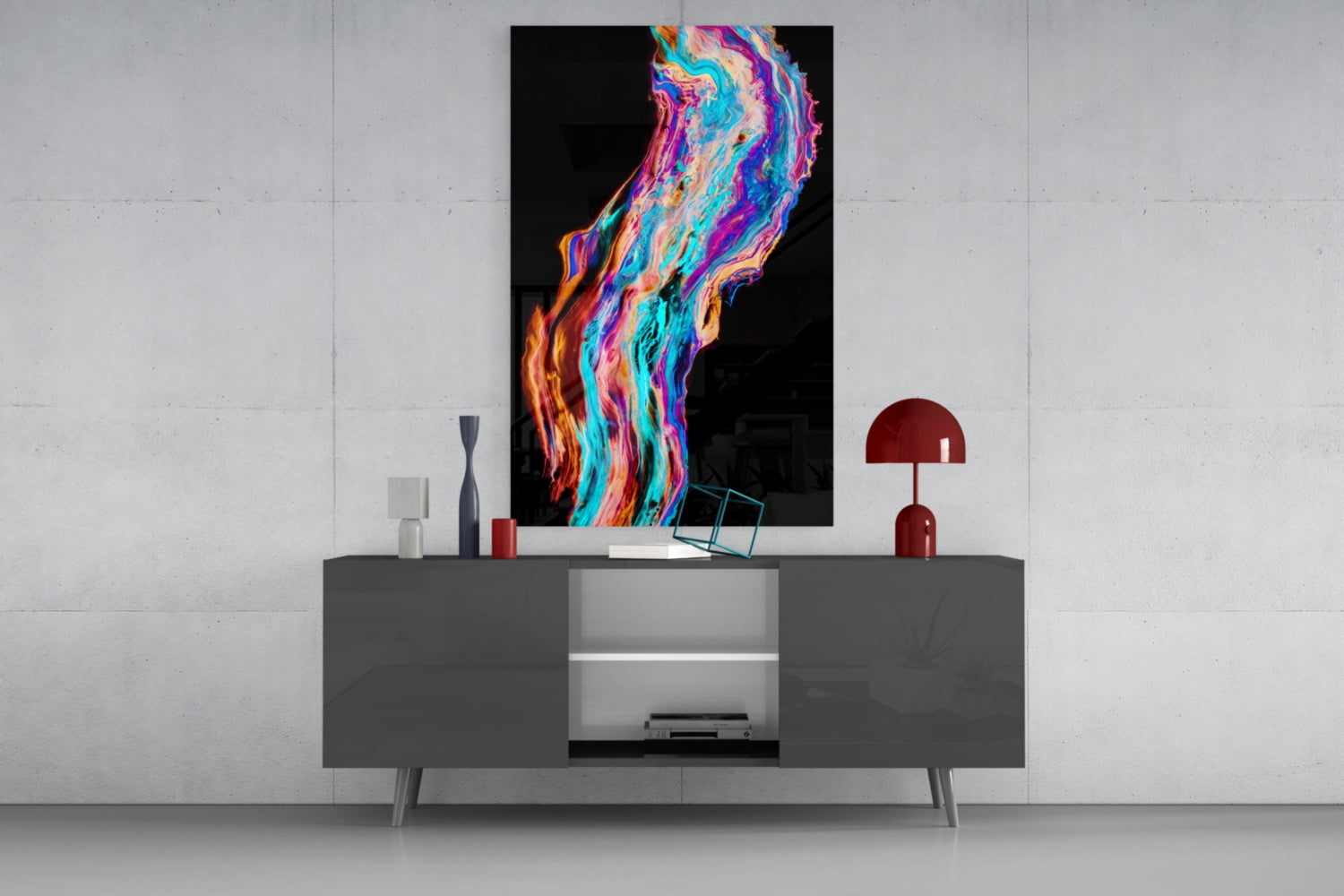 Colorful flowing glass wall art with vibrant neon swirls of blue, pink, orange, and purple displayed above a gray modern console table.