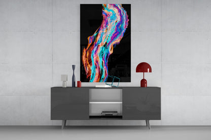 Colorful flowing glass wall art with vibrant neon swirls of blue, pink, orange, and purple displayed above a gray modern console table.