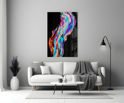 Colored Flow Glass Wall Art with vibrant neon pink, blue, and orange swirling patterns displayed above a white sofa in a modern living room.
