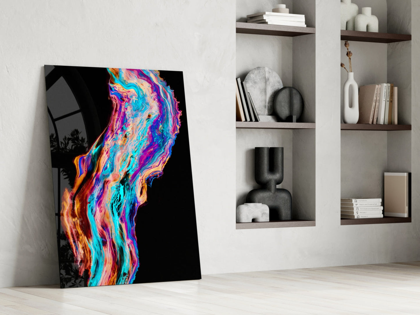 Vibrant neon-colored fluid art glass panel leaning against white wall beside built-in shelving with decorative objects.