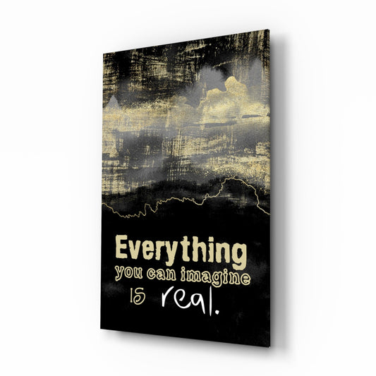 Black and gold glass wall art with textured background and white text reading "Everything you can imagine is real," displayed at an angle.
