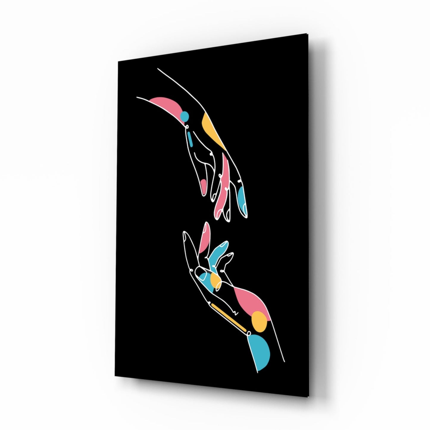 Black glass panel displaying two colorful outlined hands with pink, blue, and yellow accents on dark background, angled three-quarter view.
