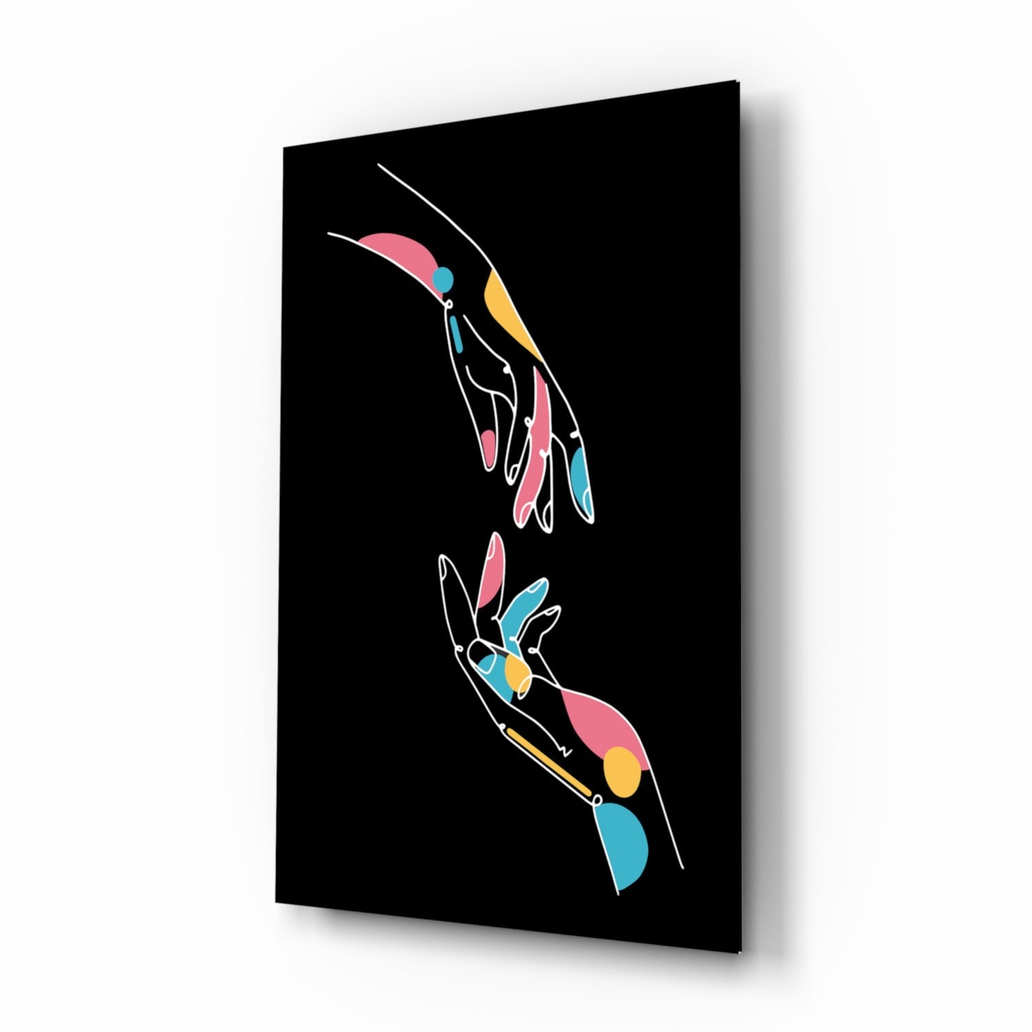Black glass panel displaying two colorful outlined hands with pink, blue, and yellow accents on dark background, angled three-quarter view.