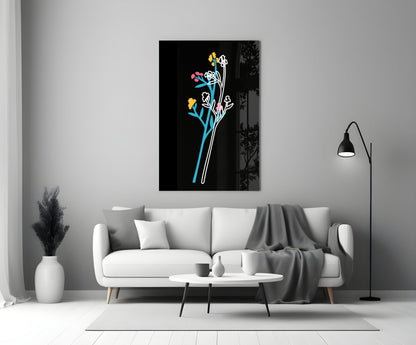 Abstract colorful flowers glass wall art displayed above white sofa in minimalist living room setting.