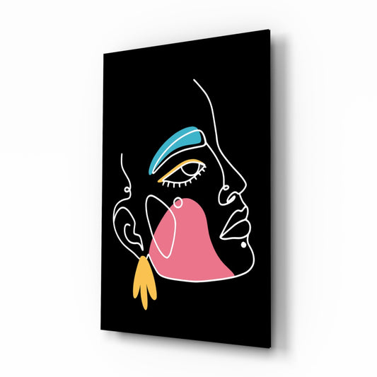 Black glass wall art featuring a minimalist line-drawn profile face with blue eyeshadow, pink mouth, yellow earring, displayed at an angle showing depth and shadow.