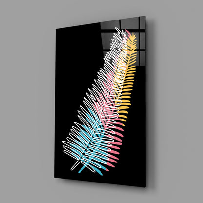 Black glass wall panel displaying a stylized fern leaf with white, cyan, pink, and yellow gradient lines against dark background, mounted at angle.