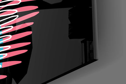 Pink and black glass fern wall art displayed in an interior space with architectural shadows and doorway visible.