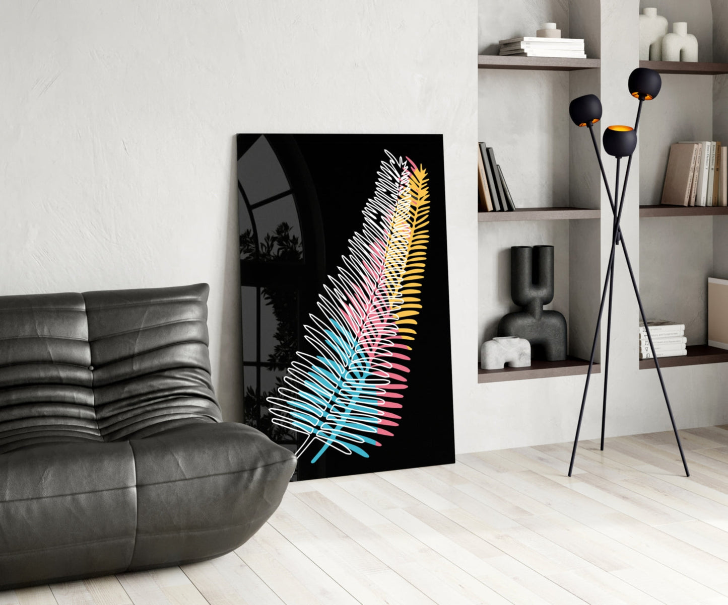 Modern living room with colorful neon fern glass art leaning against white wall beside gray sofa.