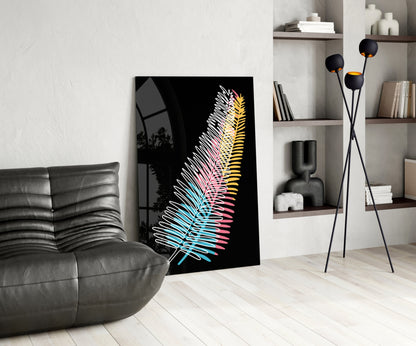 Modern living room with colorful neon fern glass art leaning against white wall beside gray sofa.