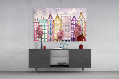Fairy Tale City Glass Wall Art displayed above a dark gray media console, showing colorful stacked buildings in pink, green, yellow, and purple tones with blooming trees.