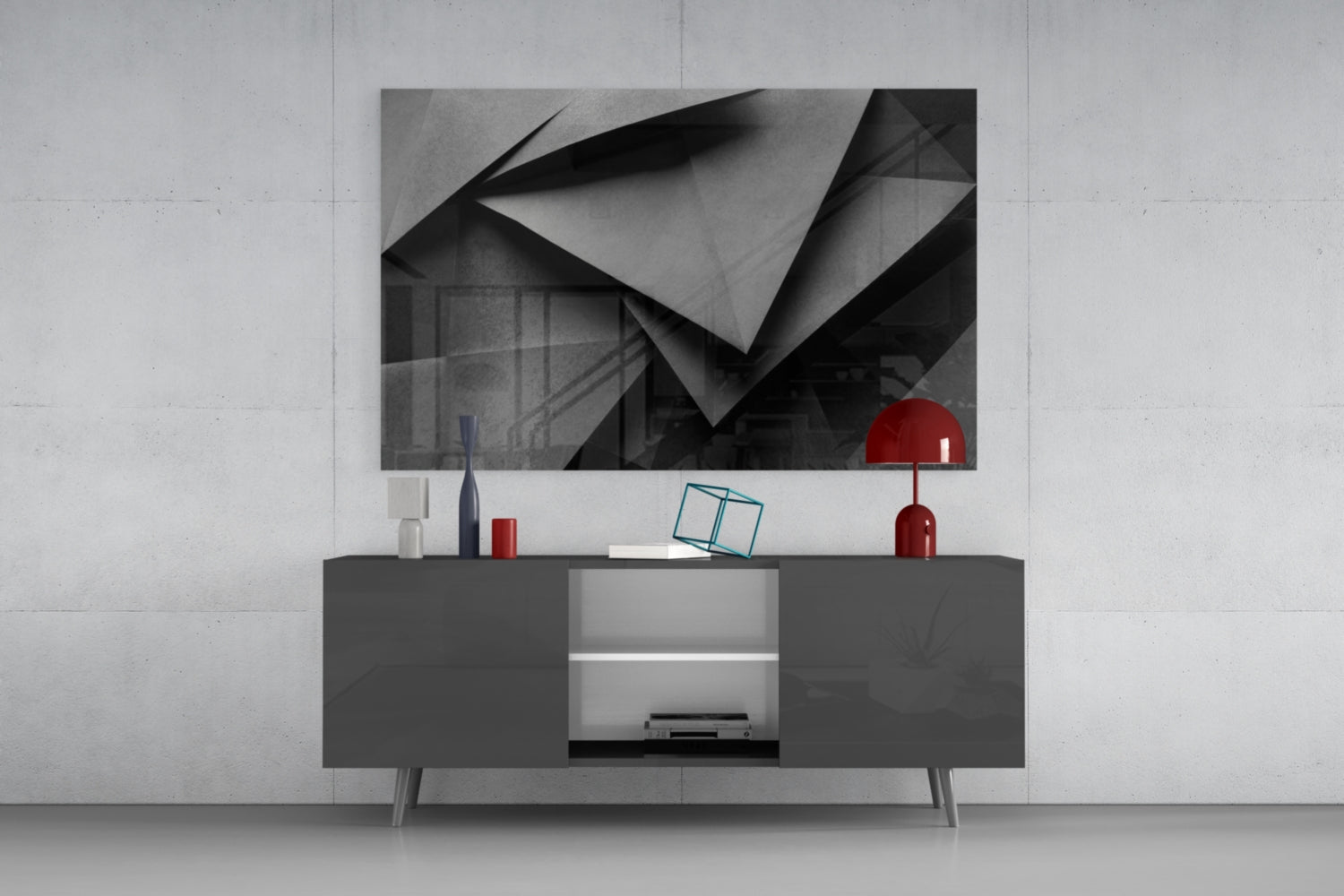 Modern living room setup featuring geometric black and white wall art above dark media console with red decorative accents.