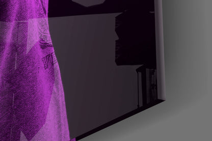 Purple lion head glass wall art mounted on gray wall, illuminated by magenta lighting from left side.