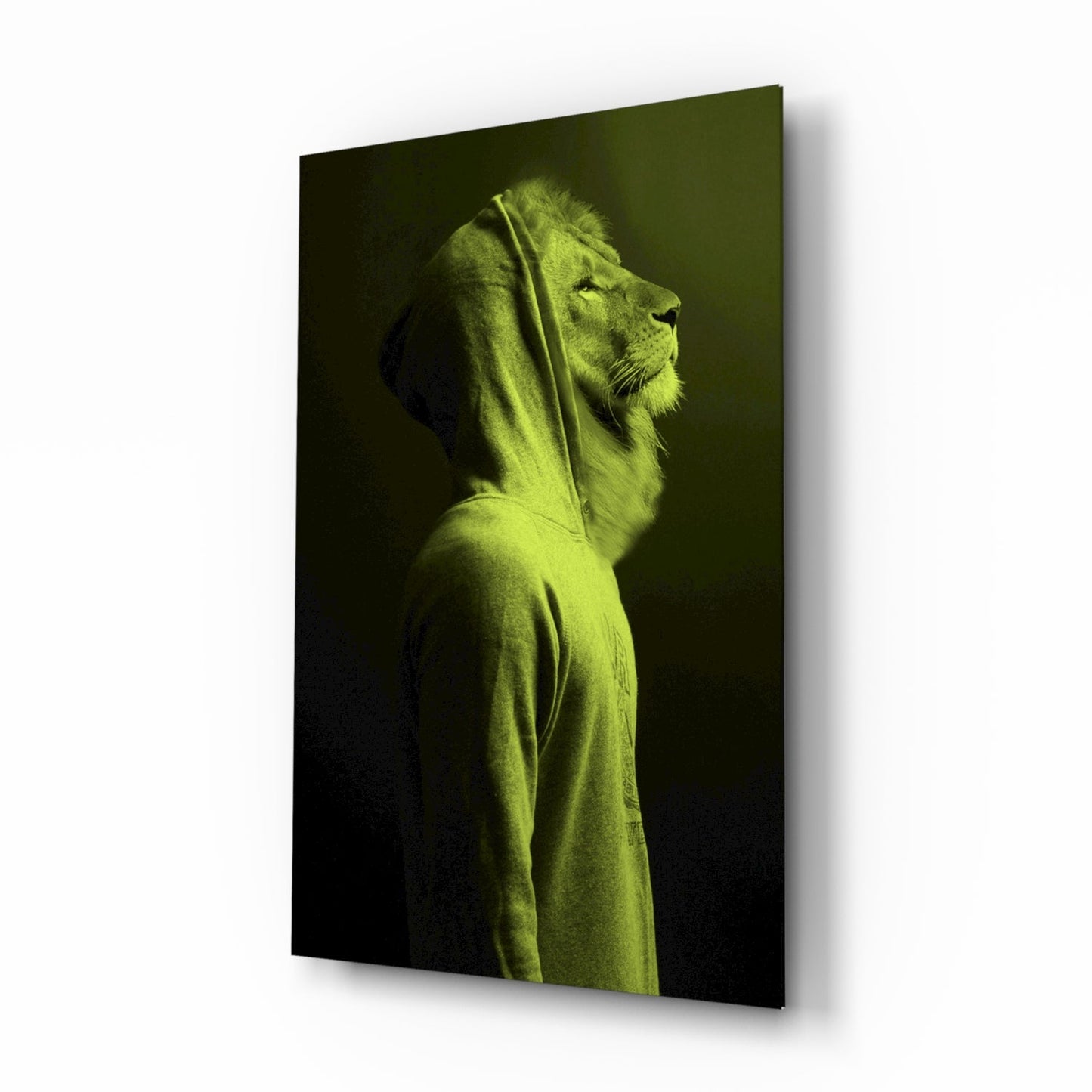 Lion's head in profile wearing a neon lime-green hoodie against dark background on glass panel.
