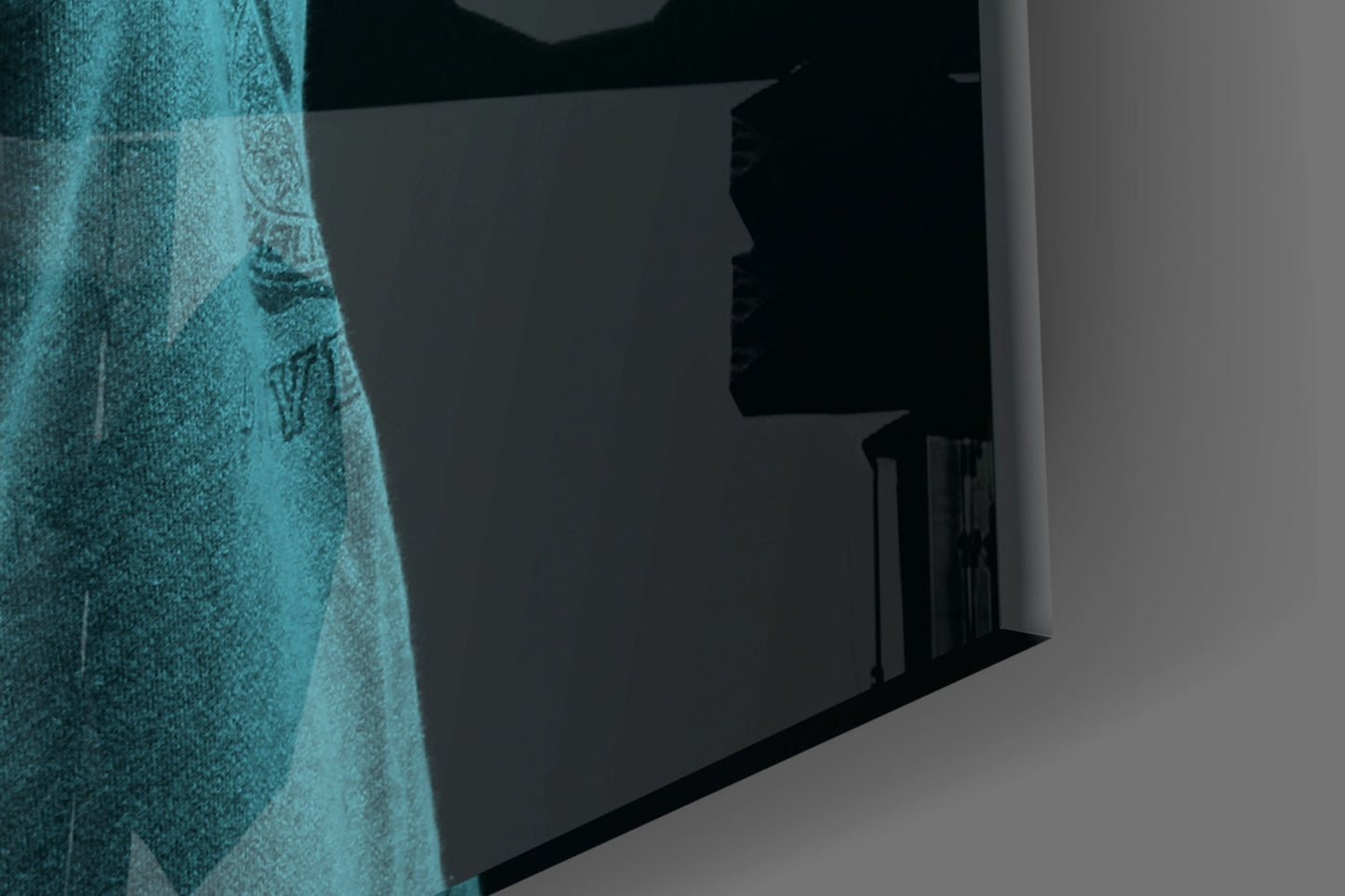 Blue lion head glass wall art displayed at an angle showing textured turquoise surface against dark interior wall.