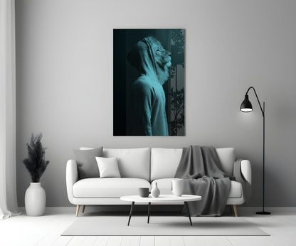 Blue-toned glass wall art depicting a lion's head in profile, displayed above a white sofa in a minimalist living room setting.