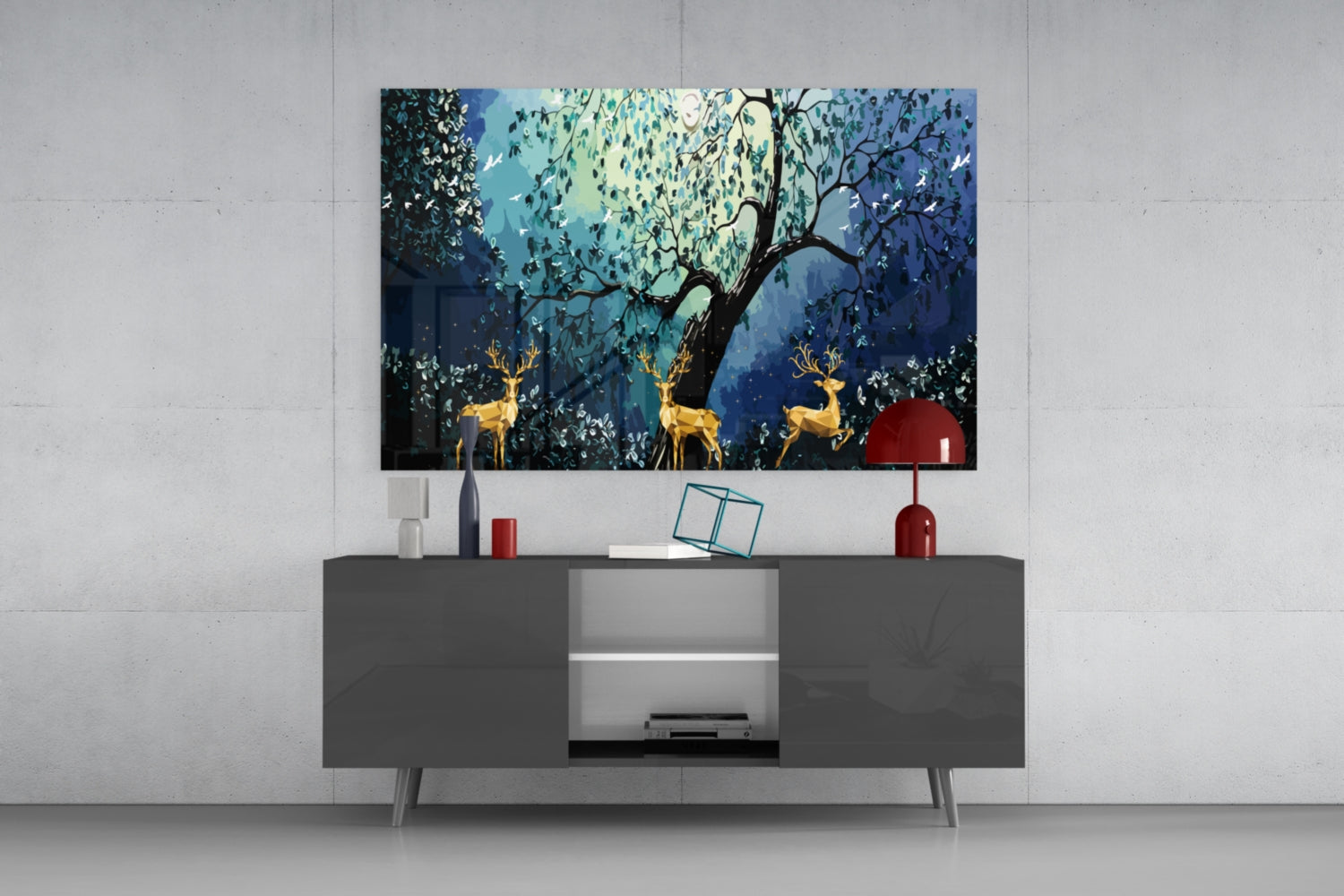 Golden Deers Glass Wall Art displayed above gray media console, showing blue forest scene with three gold deer and central tree.