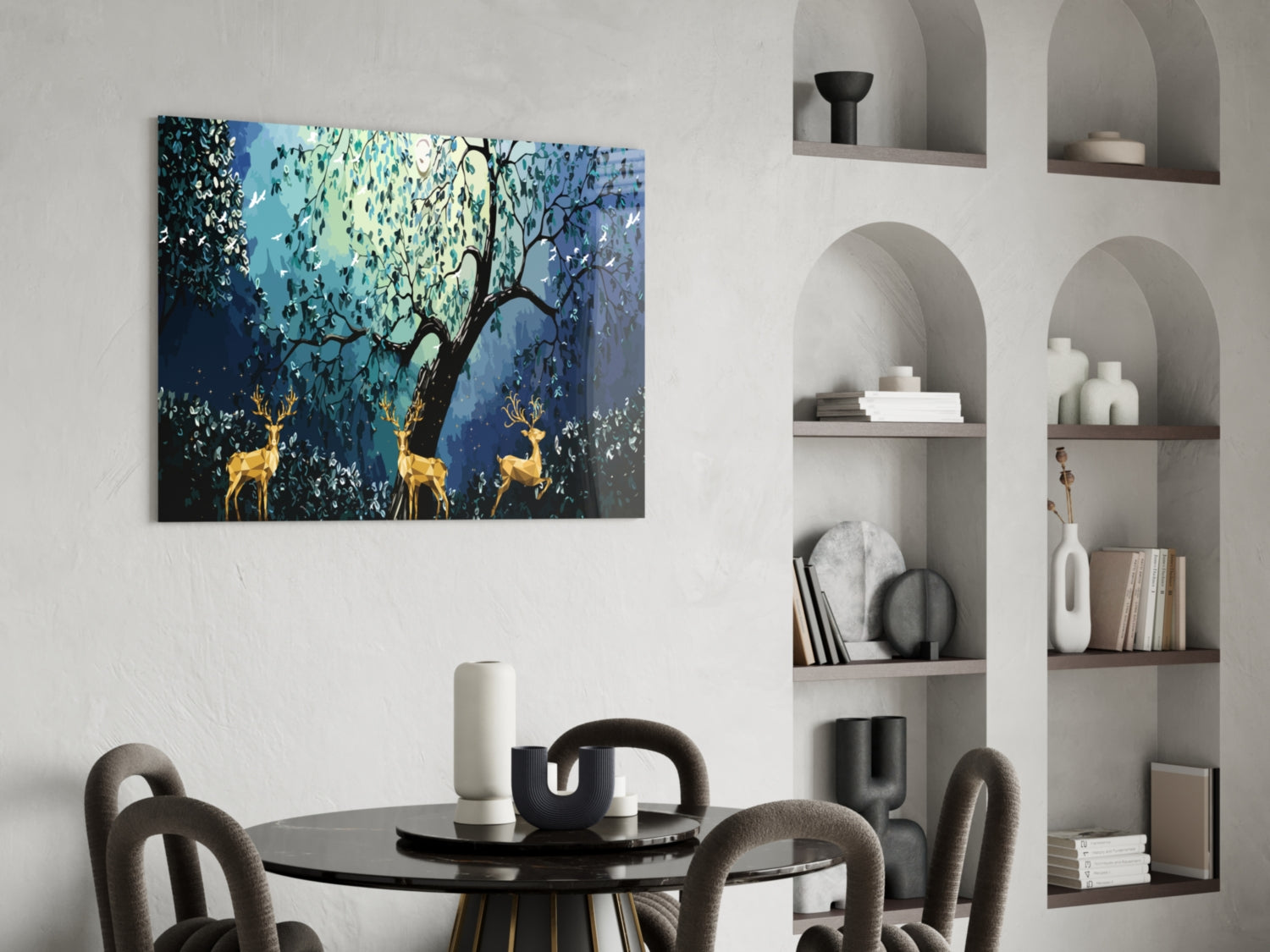Golden Deers Glass Wall Art displayed above black round dining table in modern interior with built-in wall shelving.