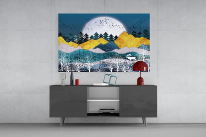 Colorful landscape glass wall art featuring layered mountains, moon, and forest displayed above gray media console with decorative objects.