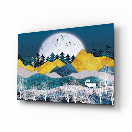 Glass wall art displaying layered mountain landscape with full moon, golden peaks, evergreen trees, birch forest, moose, and birds in teal, yellow, white, and blue tones.