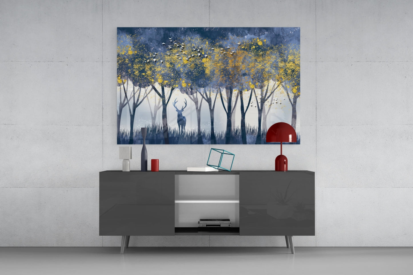 Lonely Deer Glass Wall Art displayed above a dark gray media console, showing a forest scene with blue tones, yellow foliage, and a central deer silhouette.