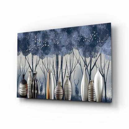 Angled perspective of glass wall art featuring decorative vases beneath stylized dark blue trees with flying birds and sparkle effects.
