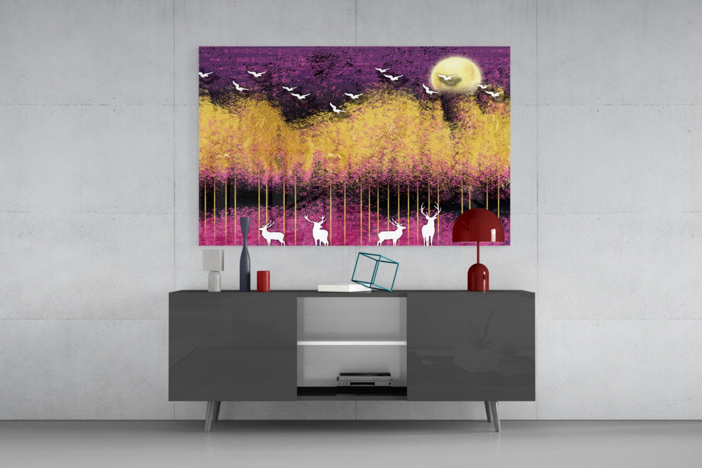 Modern living room with glass wall art above dark grey media console, featuring purple, yellow, and pink landscape with silhouetted deer and birds.