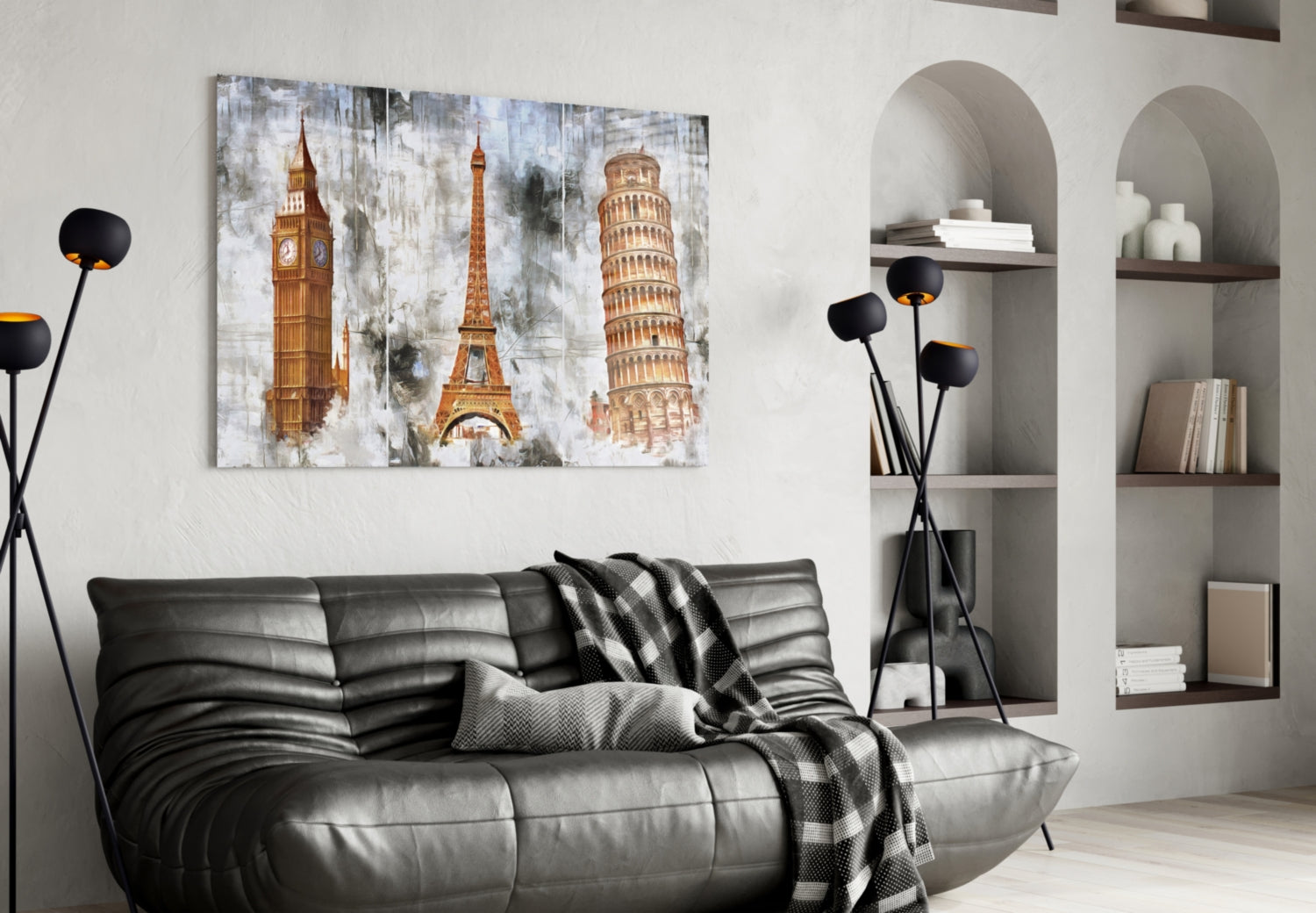Famous Towers Glass Wall Art displaying Big Ben, Eiffel Tower, and Leaning Tower of Pisa in gold tones hung above gray leather sofa in modern living room.