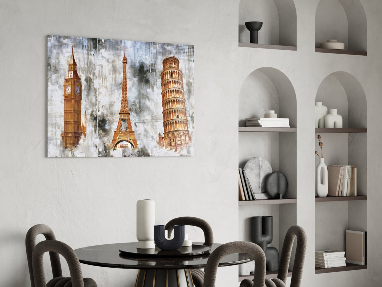 Famous Towers glass wall art displaying Big Ben, Eiffel Tower, and Leaning Tower of Pisa in gold tones on distressed white background, hung above round black dining table.