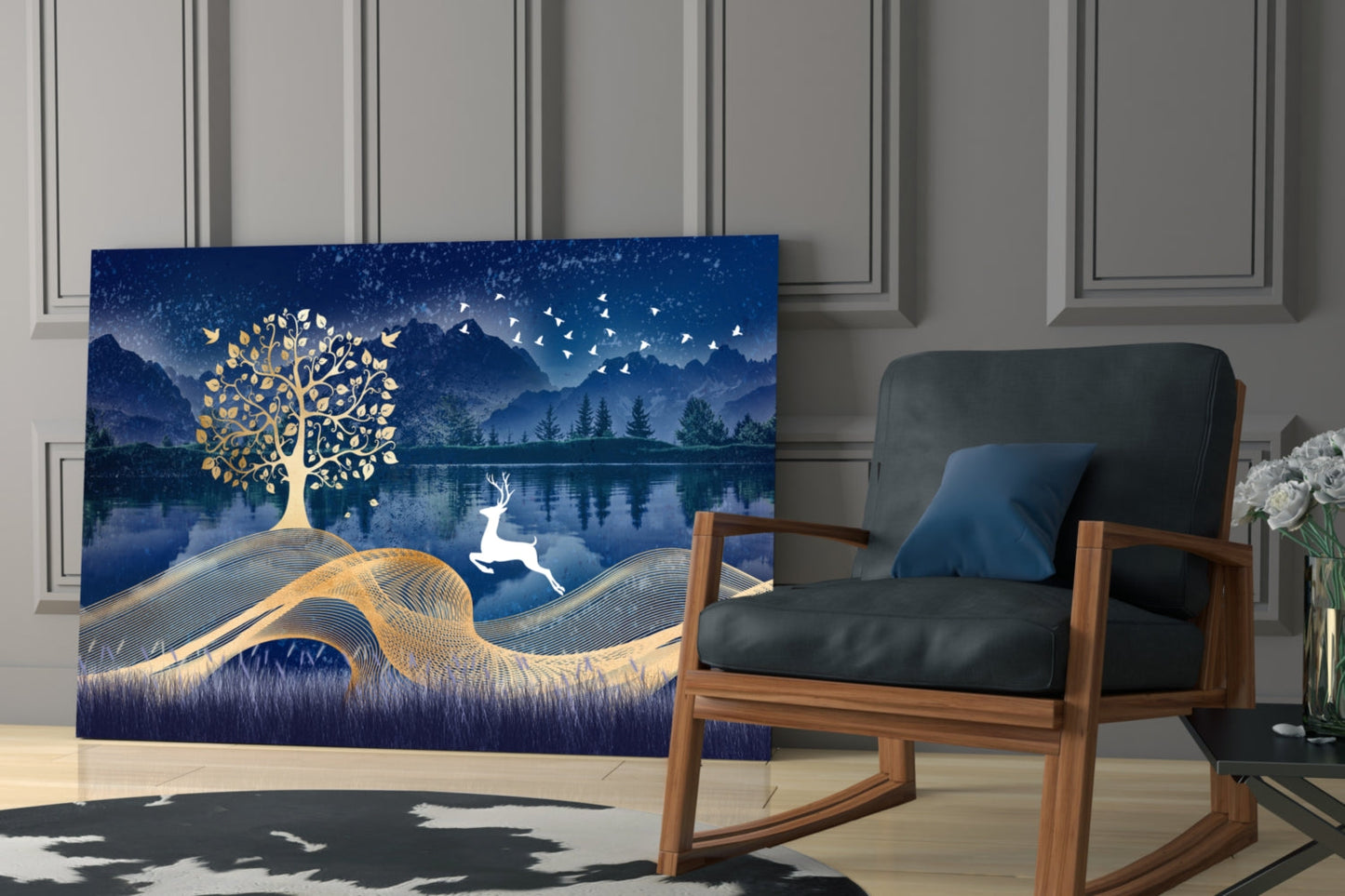 Magic Deer Glass Wall Art displayed in a modern living room beside a wooden chair, featuring gold tree and white deer on deep blue landscape background.