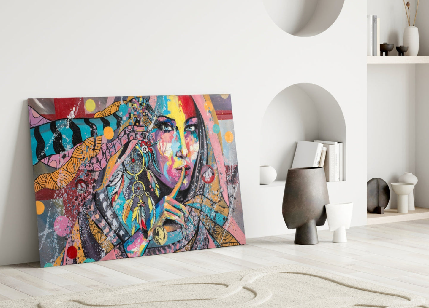 Colorful pop art glass panel featuring a woman's face with vibrant geometric patterns leaning against a white wall in a minimalist interior setting.